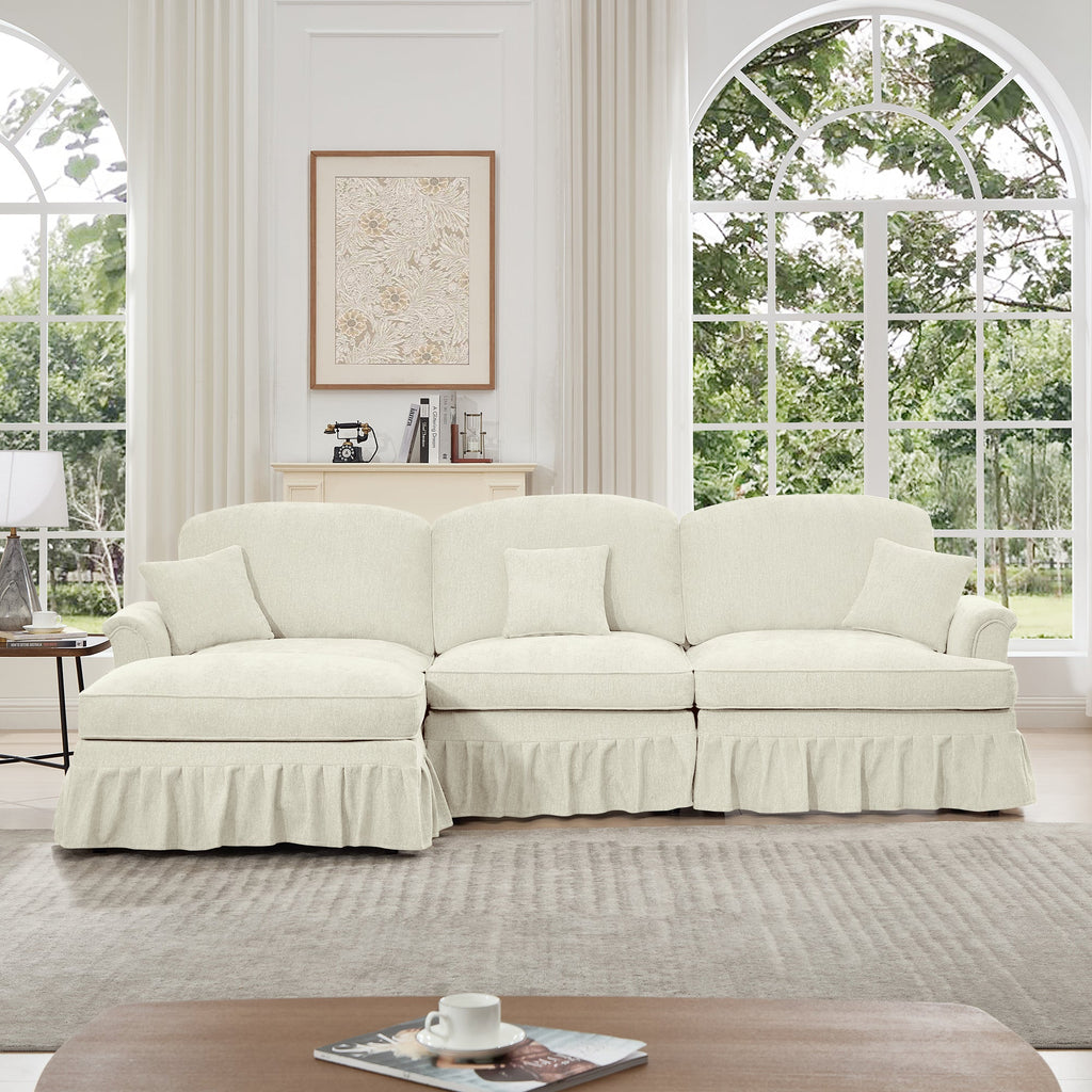 Mid Century Three Seater Modular L Shaped Sectional Couch with Flared Arms and Removable Ruffles Pleats Skirts and Spindle Legs, Comfy Chenille 3-Seat Deep Seat Sofa with Movable Ottoman, Beige White
