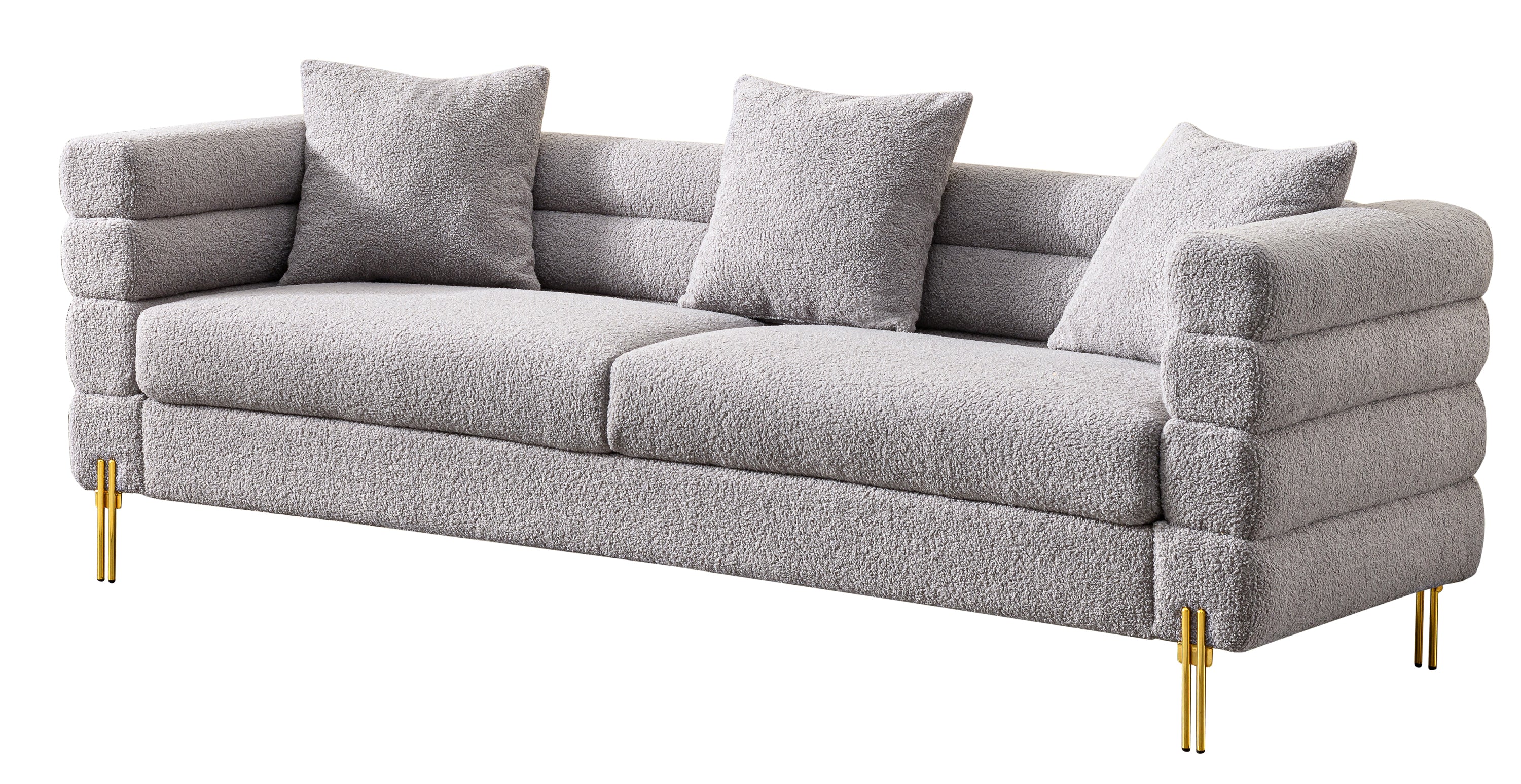 Luxurious and comfortable upholstered sofa with golden legs and pillows for living room and reception area