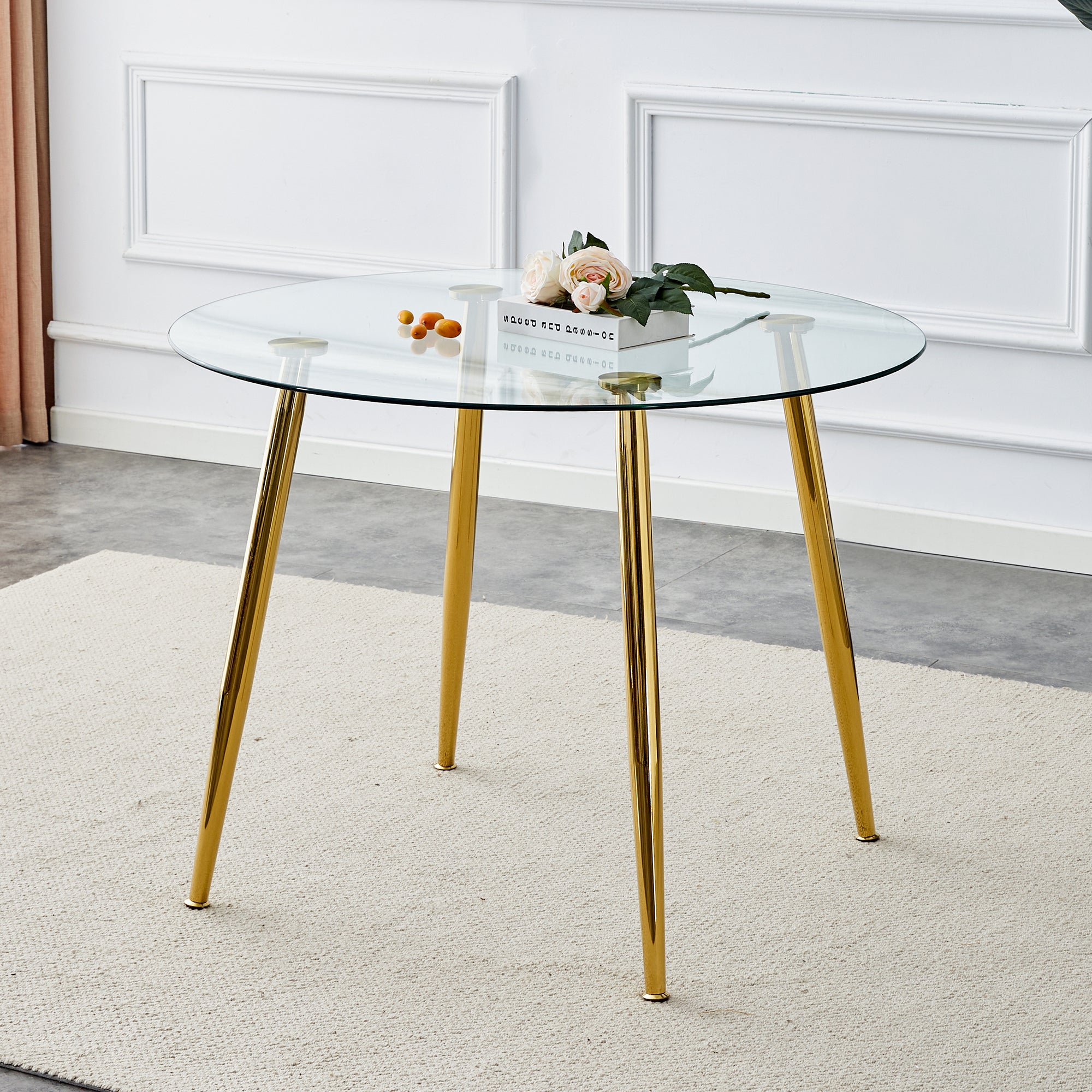 A glass tabletop with a diameter of 40 inches and a modern minimalist circular dining table with gold plated metal legs. 40 '* 40' * 30 ' DT-1164.W1151S00375