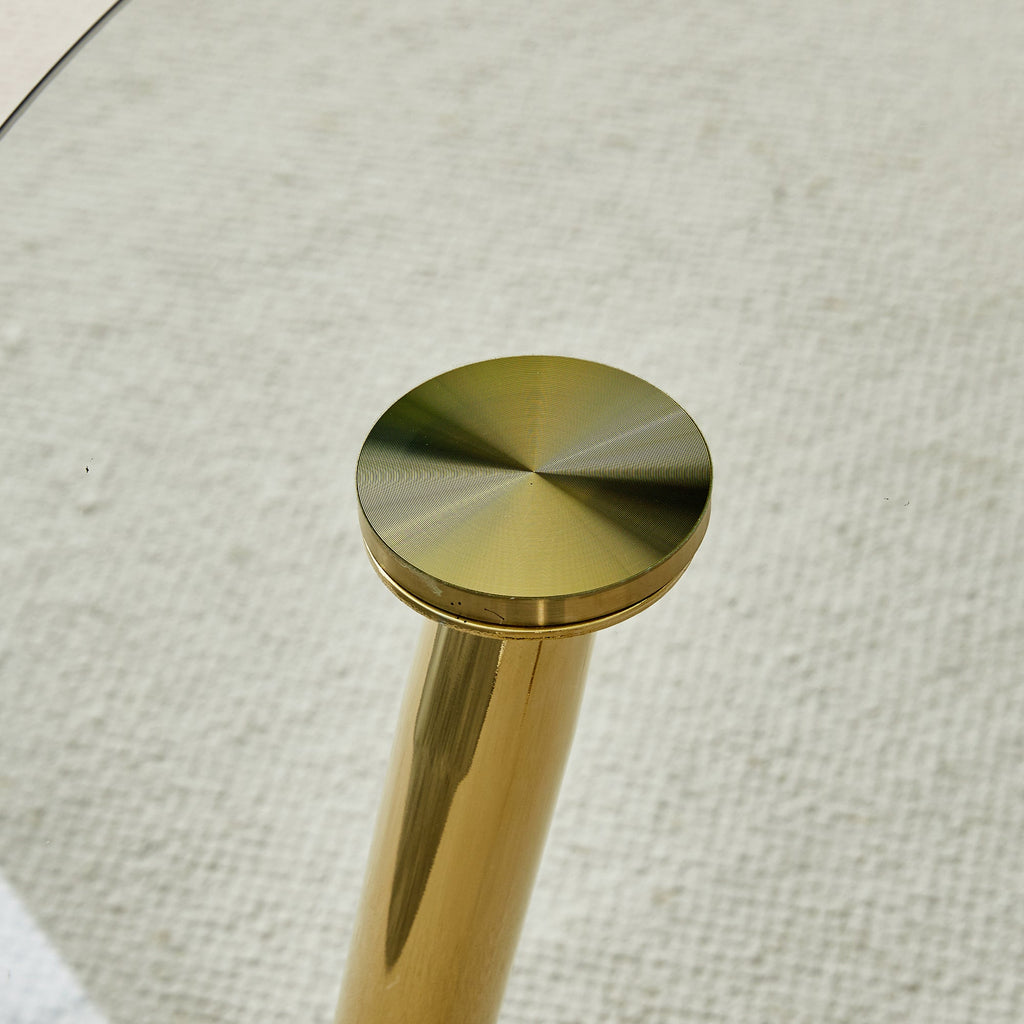 A glass tabletop with a diameter of 40 inches and a modern minimalist circular dining table with gold plated metal legs. 40 '* 40' * 30 ' DT-1164.W1151S00375